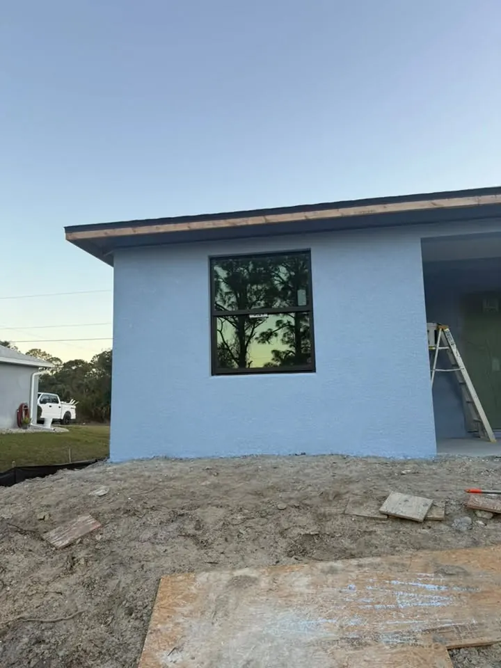 Painted light blue side wall of a new home
