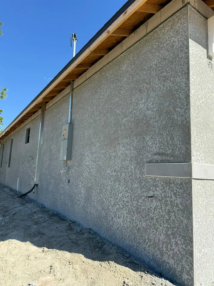 Raw gray stucco wall before painting
